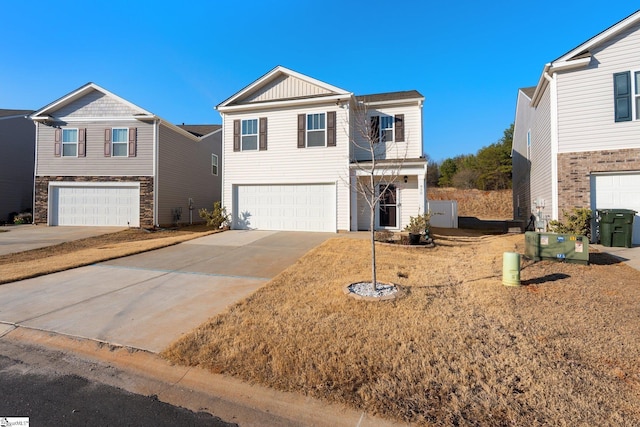 view of front of house featuring a garage, driveway, and board and batten siding