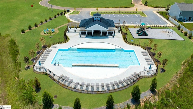 view of swimming pool featuring a patio area, fence, and a gazebo