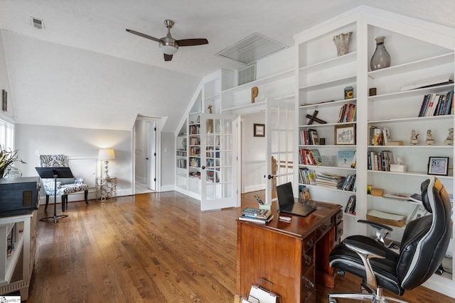 office space featuring visible vents, a ceiling fan, wood finished floors, vaulted ceiling, and french doors