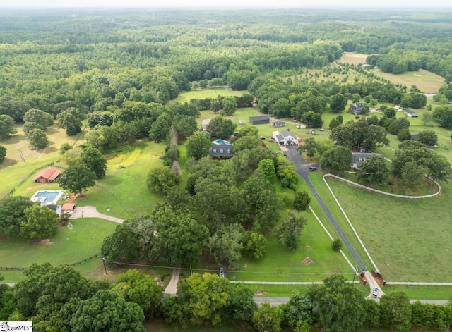 birds eye view of property with a rural view