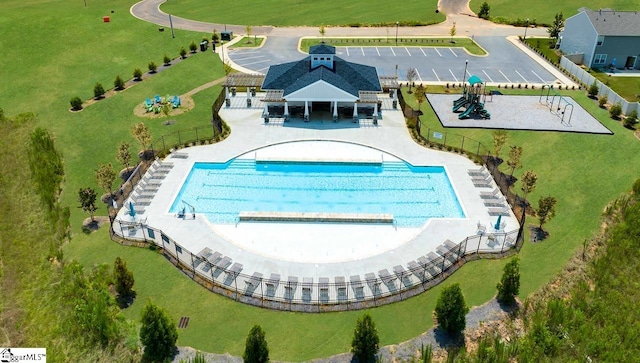 view of swimming pool with fence, a patio, and a gazebo