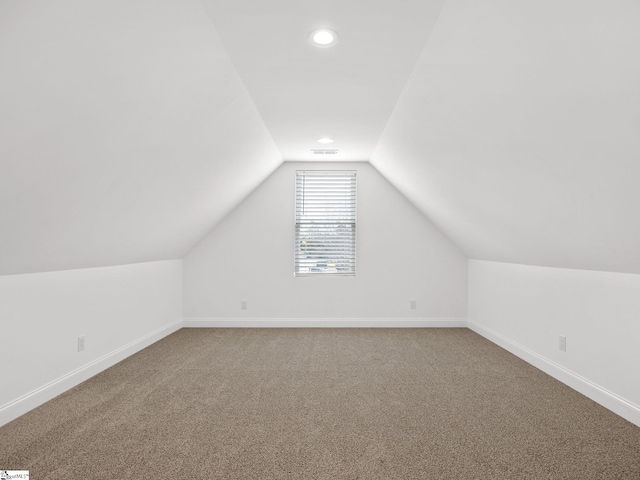 bonus room featuring visible vents, baseboards, carpet, vaulted ceiling, and recessed lighting