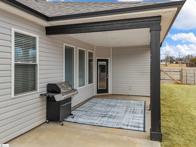 view of patio / terrace featuring fence and grilling area