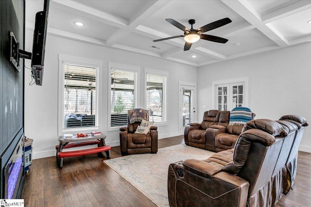 living area featuring baseboards, coffered ceiling, wood finished floors, and beamed ceiling