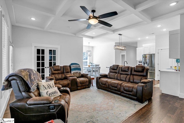 living room with beamed ceiling, coffered ceiling, dark wood-type flooring, and french doors