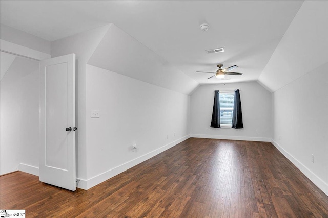 bonus room with lofted ceiling, baseboards, visible vents, and hardwood / wood-style floors