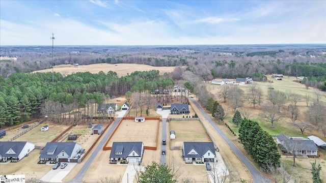 drone / aerial view featuring a view of trees