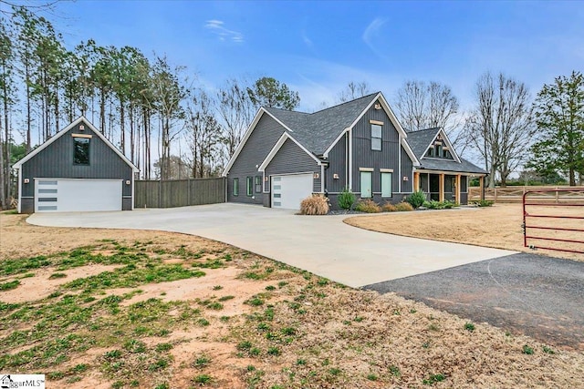 view of front facade featuring a garage and fence