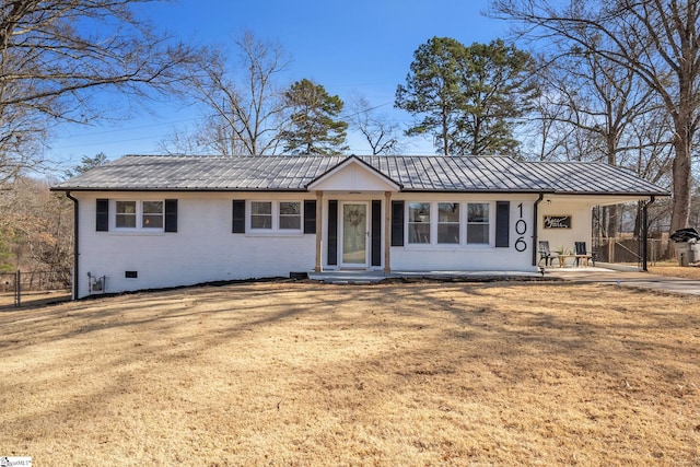 single story home with brick siding, a front yard, crawl space, metal roof, and fence