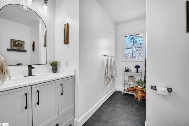 bathroom featuring vanity and baseboards