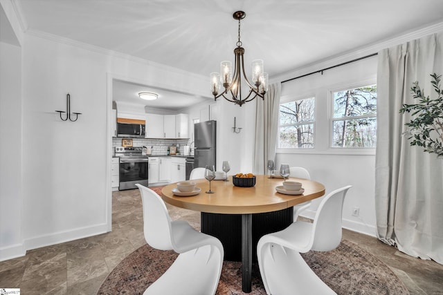 dining space with baseboards and crown molding