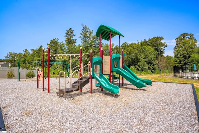 communal playground featuring fence