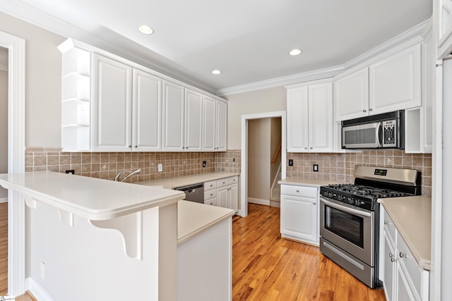 kitchen with stainless steel appliances, a peninsula, open shelves, and white cabinets