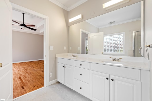 full bath with ceiling fan, a sink, ornamental molding, tile patterned floors, and double vanity