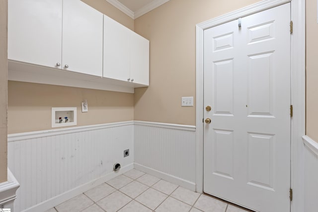 clothes washing area featuring hookup for a washing machine, ornamental molding, wainscoting, cabinet space, and electric dryer hookup