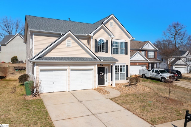 traditional home featuring a front lawn, concrete driveway, and roof with shingles