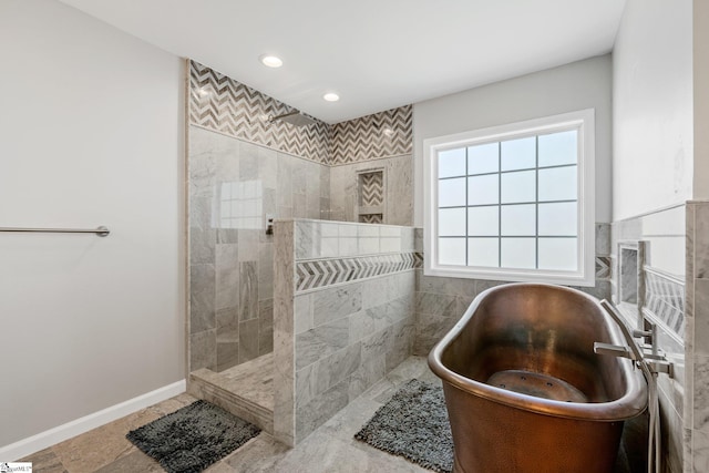 full bathroom with recessed lighting, a freestanding bath, baseboards, and a walk in shower