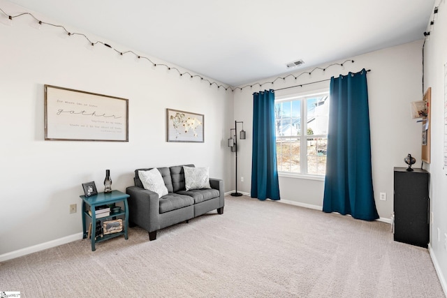 sitting room featuring carpet, visible vents, and baseboards