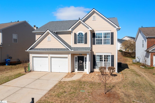 traditional home featuring a shingled roof, a front lawn, and concrete driveway