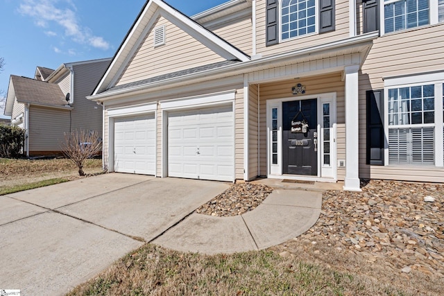 exterior space featuring driveway and an attached garage