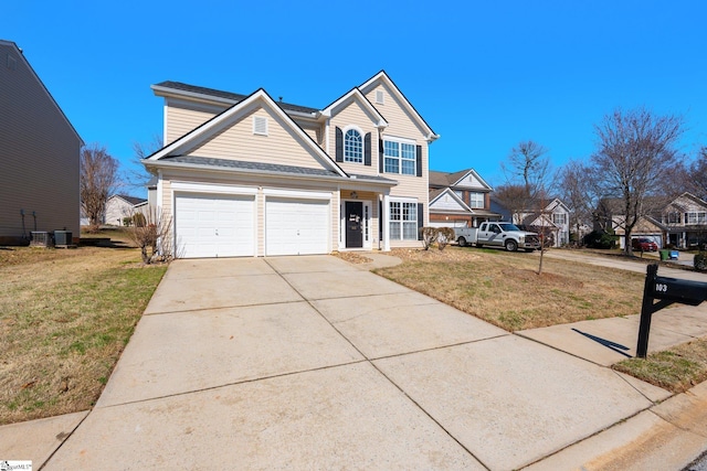 traditional-style home with a front yard, central AC, driveway, and an attached garage