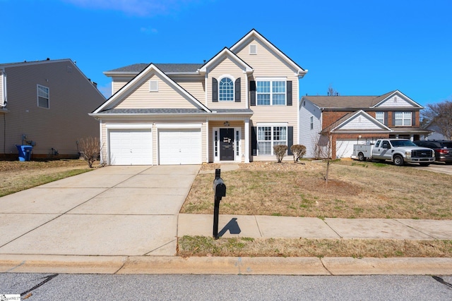 traditional-style home featuring concrete driveway and a front lawn