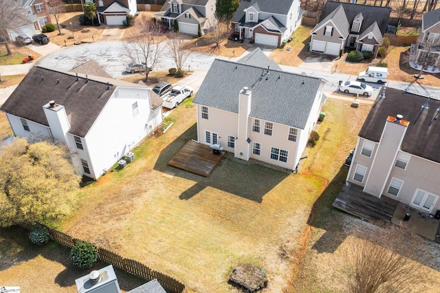 birds eye view of property with a residential view