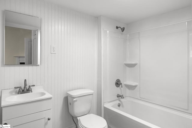 bathroom with shower / bathtub combination, vanity, and toilet