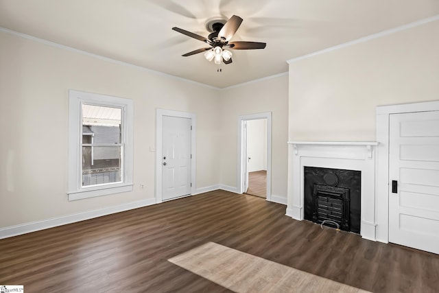 unfurnished living room featuring dark wood-style floors, a fireplace, ornamental molding, ceiling fan, and baseboards