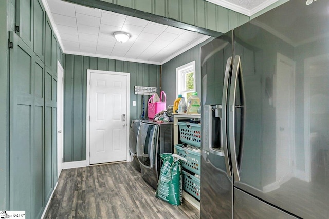 laundry area featuring laundry area, ornamental molding, dark wood-type flooring, and washer and dryer