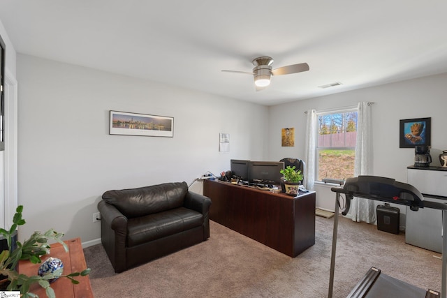 office space featuring ceiling fan, carpet, visible vents, and baseboards