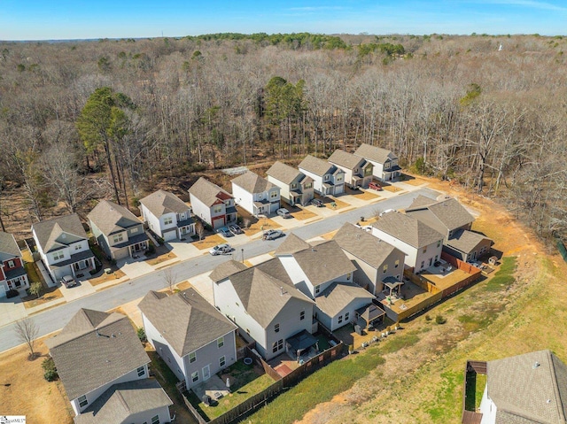 aerial view with a residential view and a view of trees