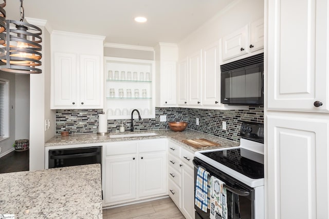 kitchen featuring decorative backsplash, ornamental molding, black appliances, white cabinetry, and a sink