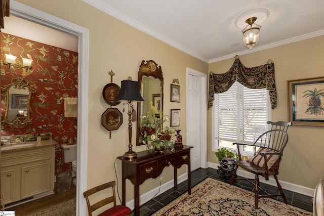 living area featuring crown molding, an inviting chandelier, and baseboards