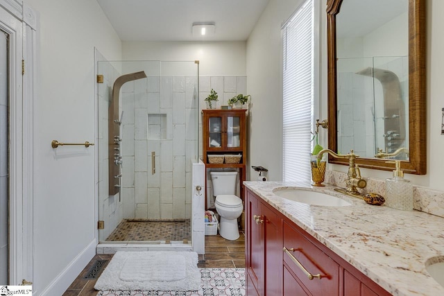 full bathroom with visible vents, a shower stall, toilet, and vanity