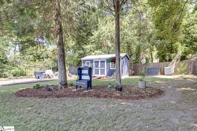 view of front of home with an outbuilding, fence, a front lawn, and a storage unit