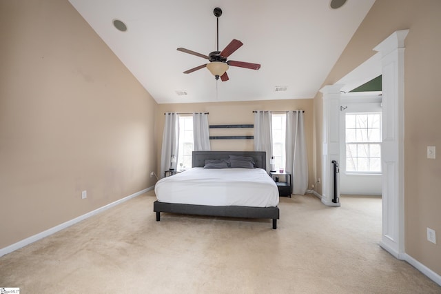 bedroom featuring decorative columns, visible vents, baseboards, a ceiling fan, and light colored carpet