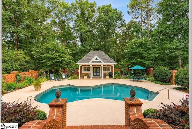 1212 Stillwater Dr, Seneca, SC 29678 - view of swimming pool featuring a patio, a storage structure, an outdoor structure, and fence