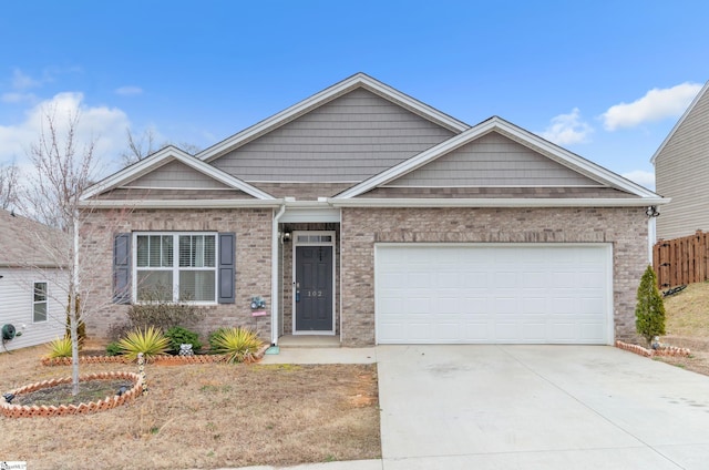 single story home with a garage, driveway, fence, and brick siding