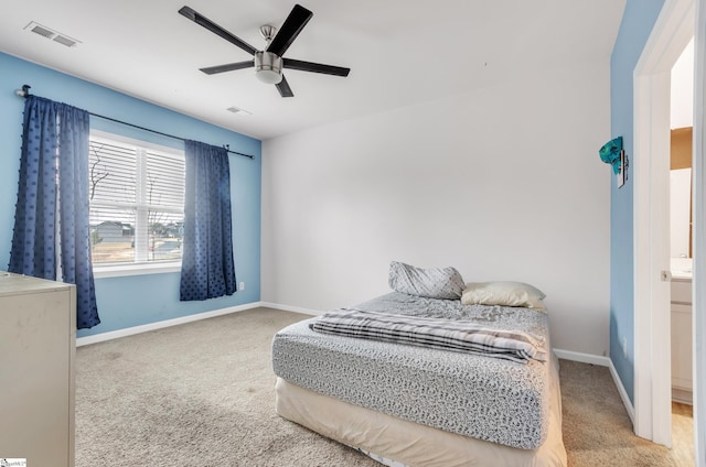 bedroom with carpet floors, baseboards, visible vents, and ceiling fan