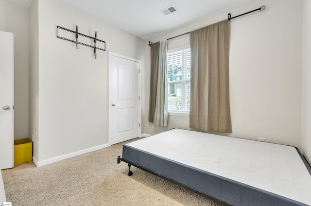 bedroom with carpet flooring, visible vents, and baseboards