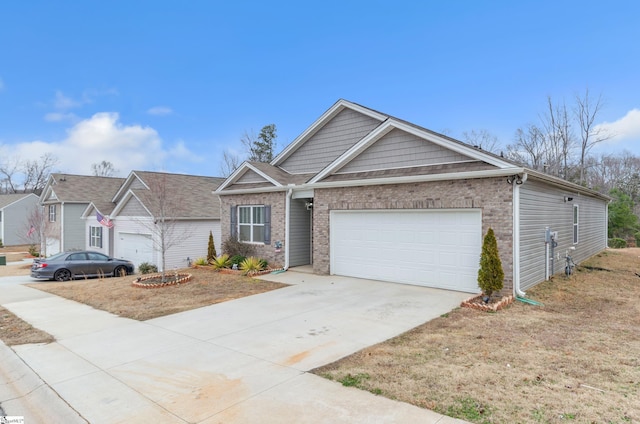 single story home featuring a garage, brick siding, and driveway