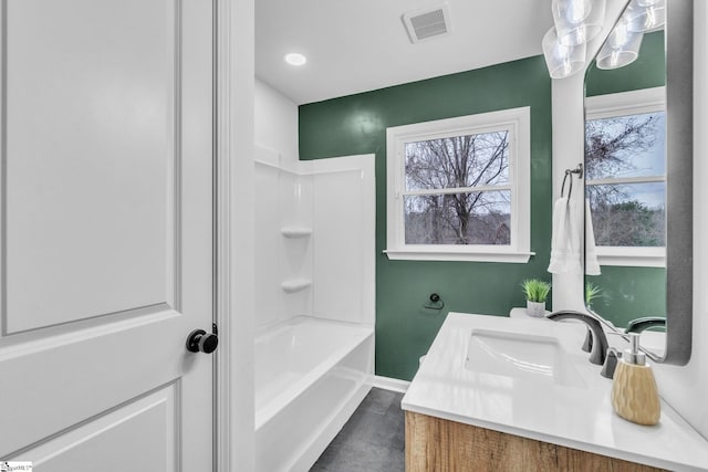 bathroom featuring baseboards, visible vents, and vanity