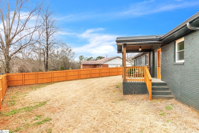 view of yard with a fenced backyard