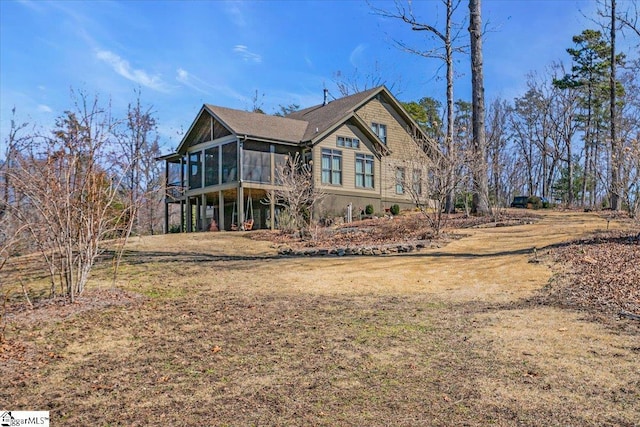 view of front facade with a sunroom