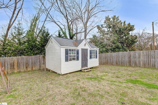 view of outbuilding with an outbuilding and a fenced backyard