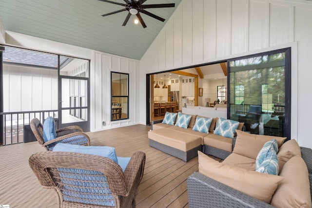 sunroom featuring vaulted ceiling and ceiling fan