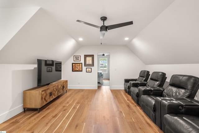 cinema room with recessed lighting, light wood-style flooring, a ceiling fan, vaulted ceiling, and baseboards