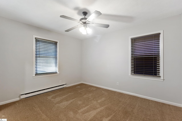 carpeted empty room with baseboard heating, a ceiling fan, and baseboards