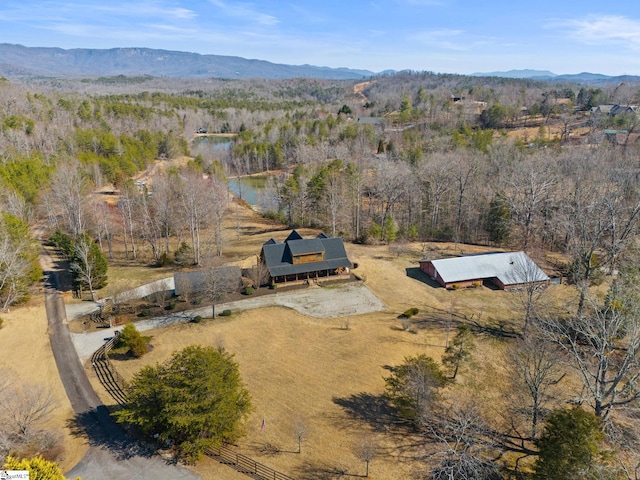 bird's eye view with a rural view, a mountain view, and a wooded view